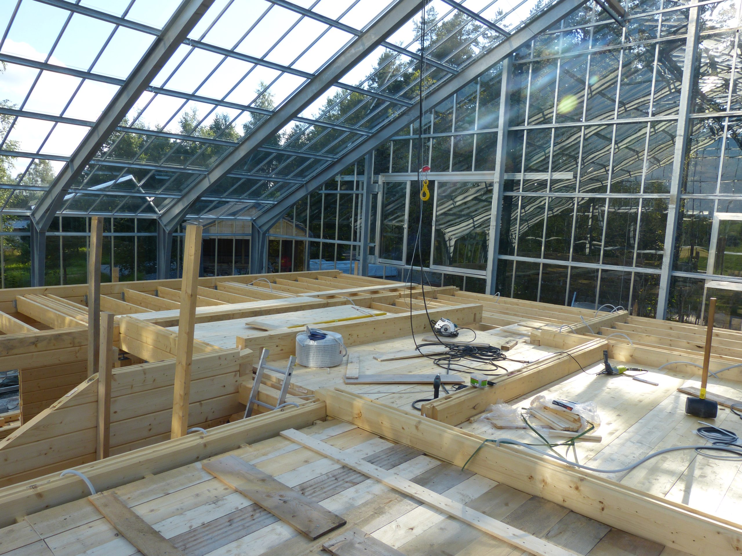 Construction of the timber house inside the greenhouse at Sundby Naturhus