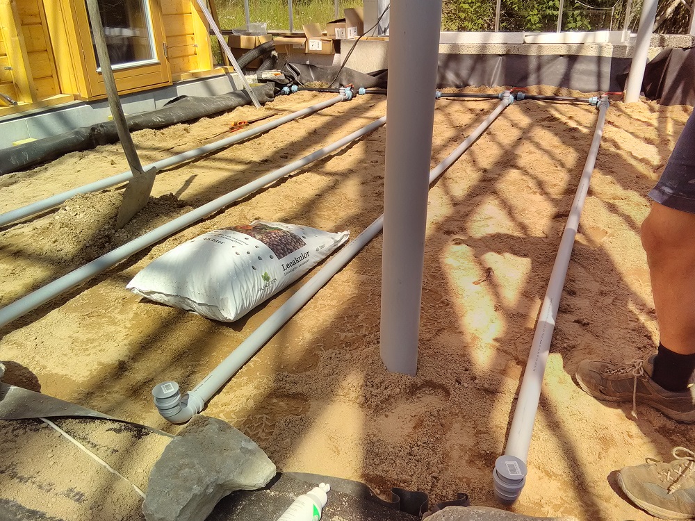 Distribution pipes and lightweight aggregate in a Sundby Naturhus planted treatment bed before the final surface layer was added.