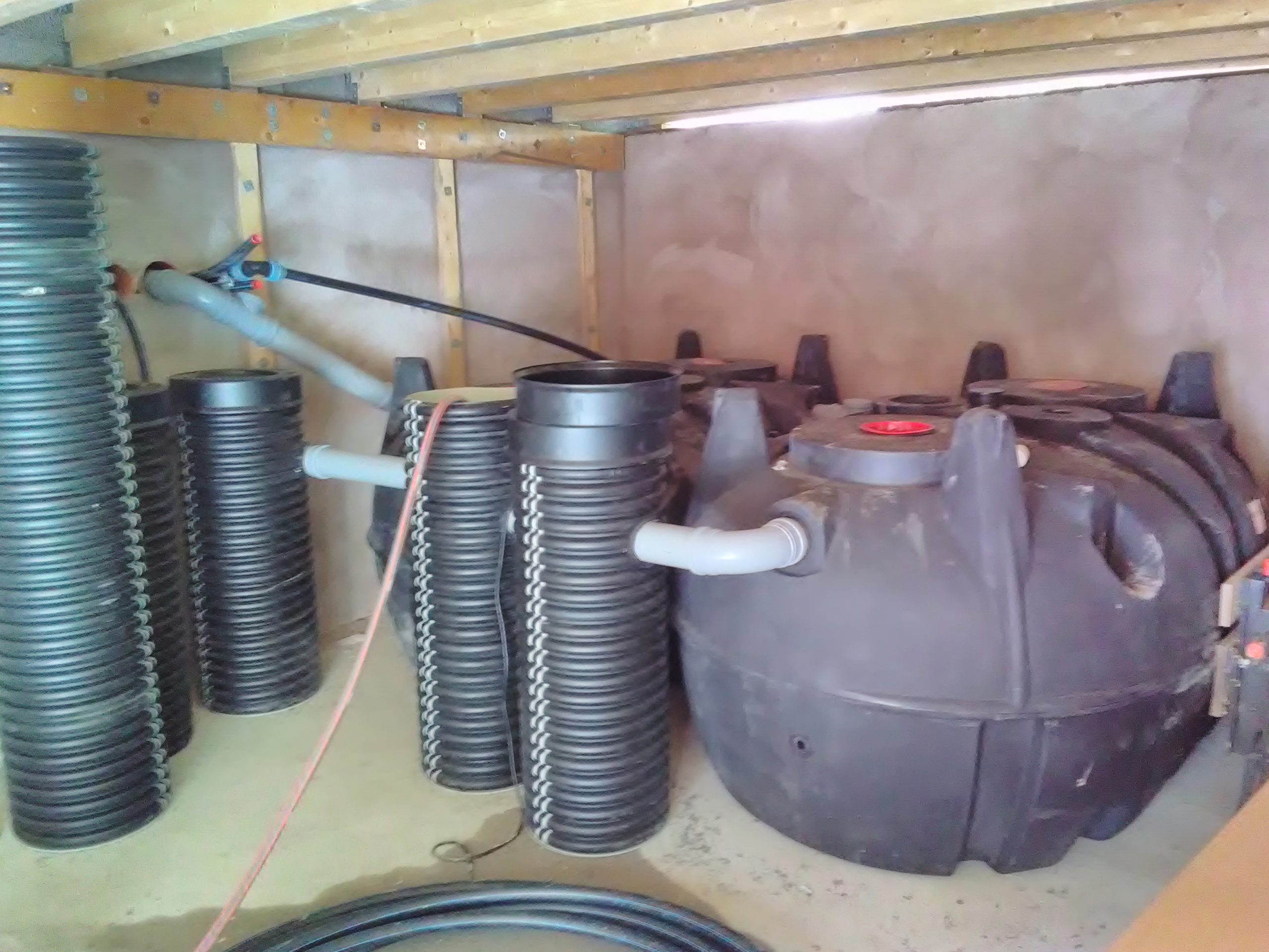 Settling and pump tanks in the service building during construction of the water system